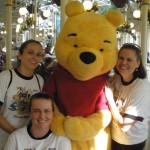 Amber and her family meeting with Winnie the Pooh 