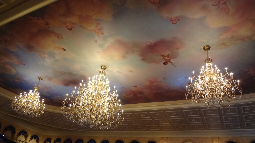 The beautiful cherub murals and chandeliers on the ceiling of the ballroom 